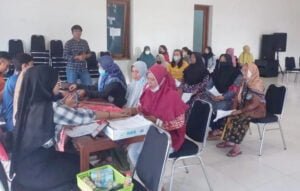 Round White Dining Table On Brown Hardwood