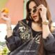 olla ramlan lepas hijab dan berpose waktu pemotretan sambil pegang jeruk pake kacamata, jaket hitam sexy dan cantik